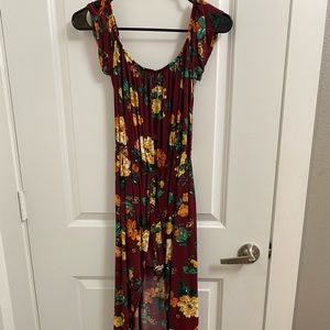 Burgundy floral romper with long flowy back. Like new condition. Size medium.
